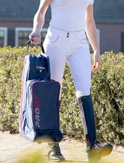 Polo player carrying boot bag