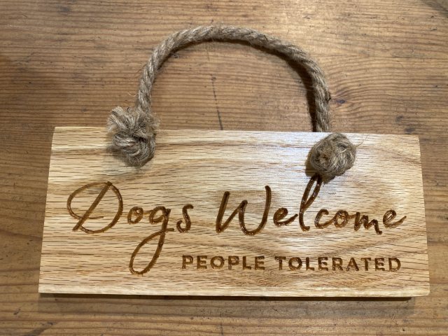 Engraved Oak Rope Hanging Sign - Dogs Welcome People Tolerated