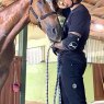 Horse in stable with rider